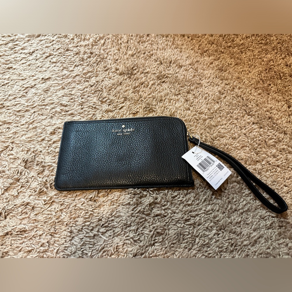 Kate Spade wristlet with tags. Brand new